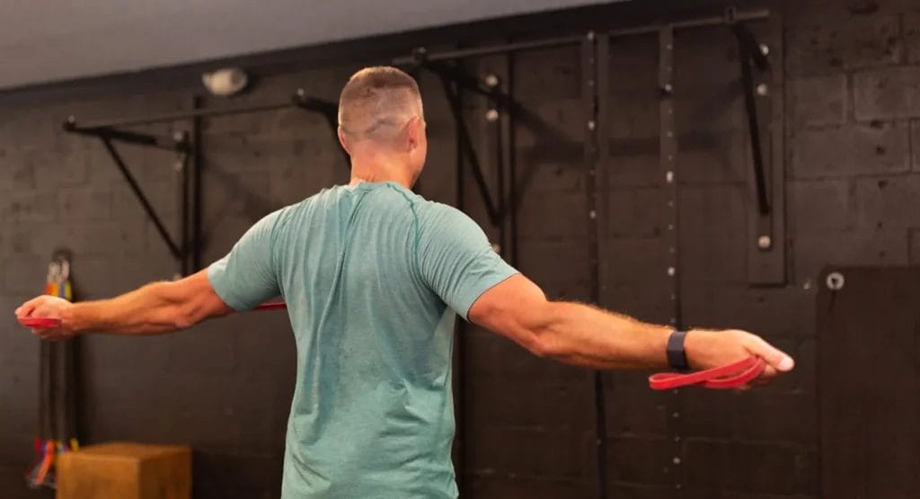 Man lifting weights during personal training session