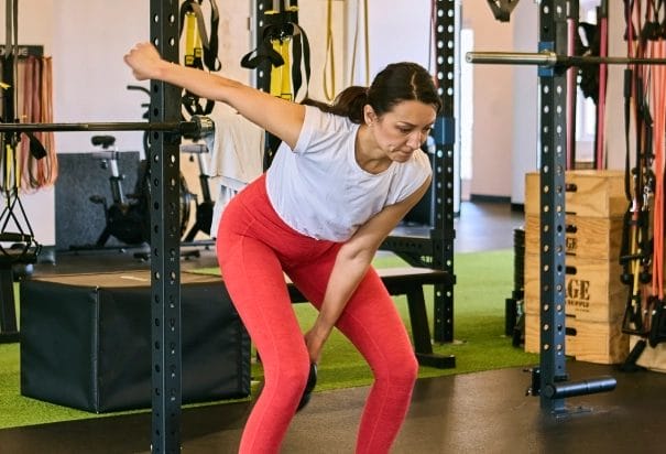 Woman warming up at Her Strength Studio